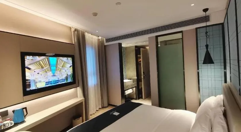 Bed in Echarm Hotel Changsha Wuyi Square Railway Metro Station