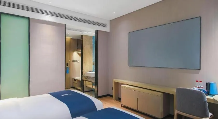 Bed in Echarm Hotel Changsha Wuyi Square Railway Metro Station