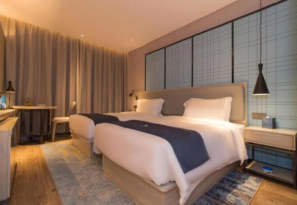 Bed in Echarm Hotel Changsha Wuyi Square Railway Metro Station