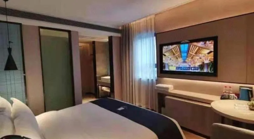 Bed in Echarm Hotel Changsha Wuyi Square Railway Metro Station