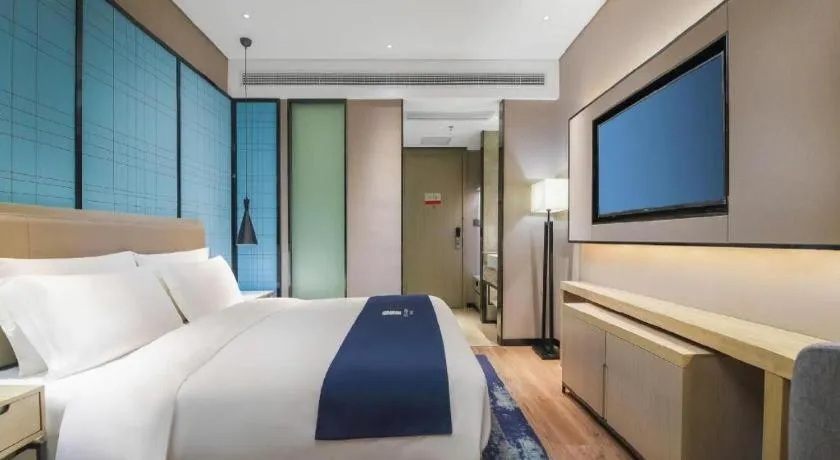 Bed in Echarm Hotel Changsha Wuyi Square Railway Metro Station