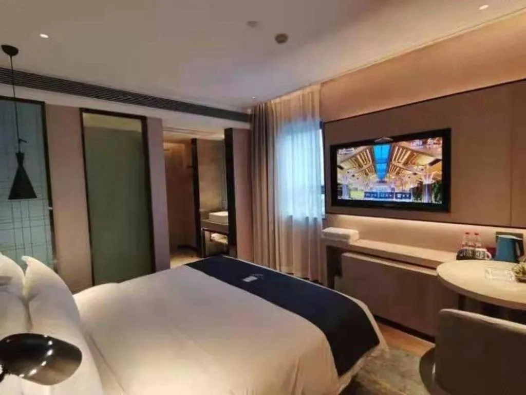 Bed in Echarm Hotel Changsha Wuyi Square Railway Metro Station