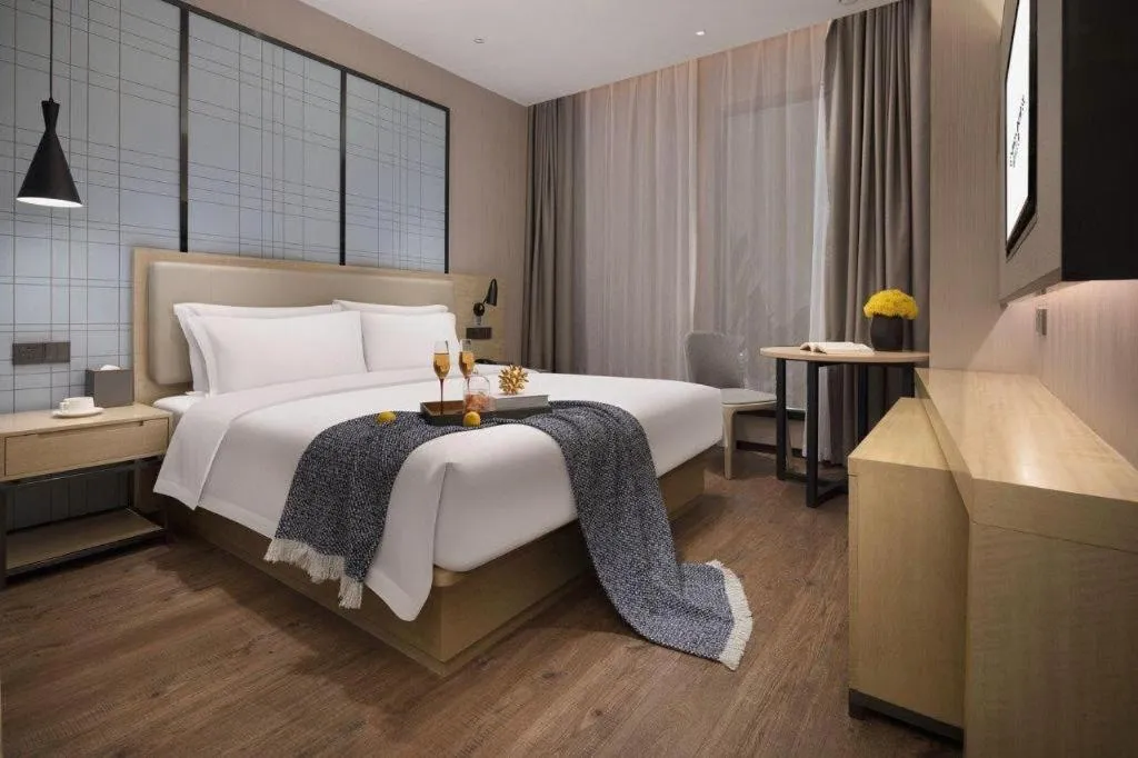 Bed in Echarm Hotel Changsha Wuyi Square Railway Metro Station