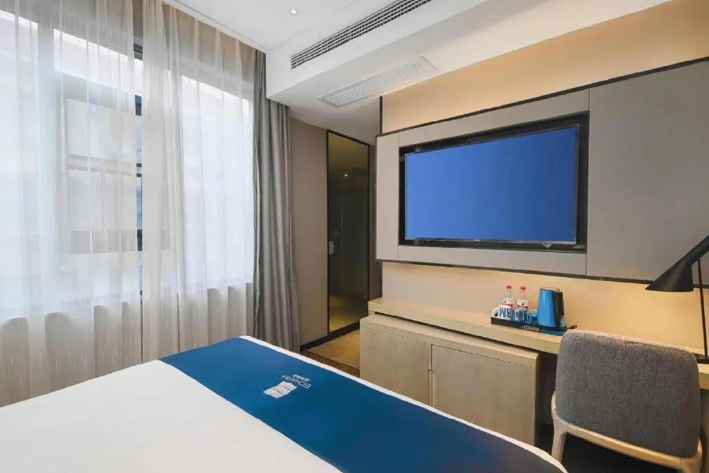 Bed in Echarm Hotel Changsha Wuyi Square Railway Metro Station