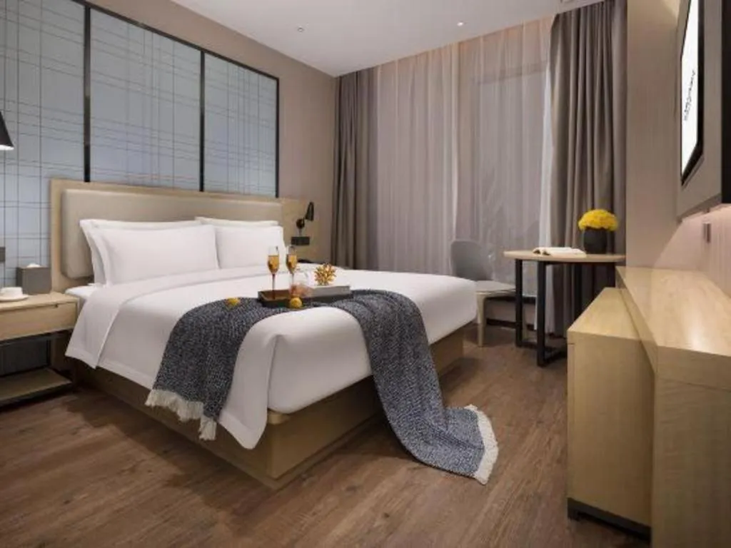 Bed in Echarm Hotel Changsha Wuyi Square Railway Metro Station