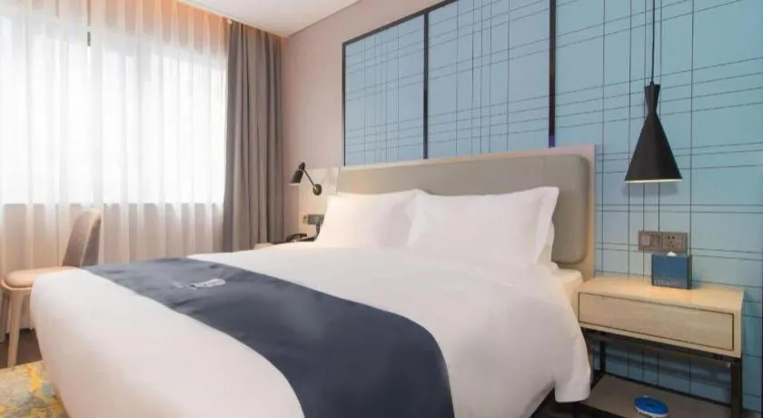 Bed in Echarm Hotel Changsha Wuyi Square Railway Metro Station