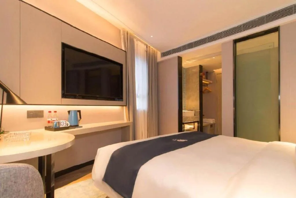 Bed in Echarm Hotel Changsha Wuyi Square Railway Metro Station