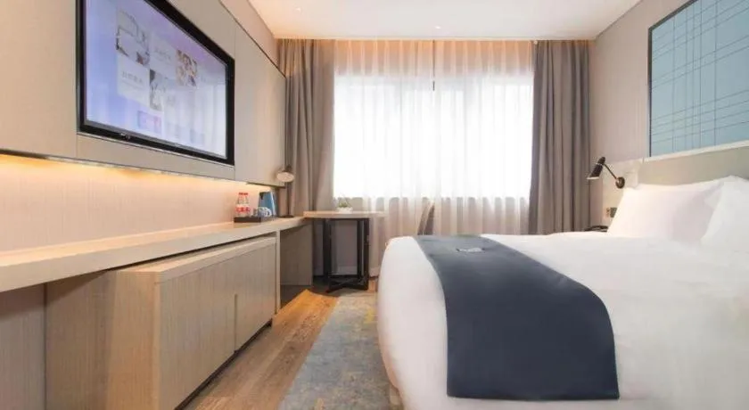 Bed in Echarm Hotel Changsha Wuyi Square Railway Metro Station