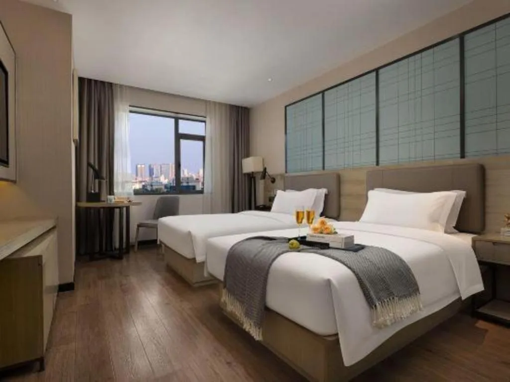Bed in Echarm Hotel Changsha Wuyi Square Railway Metro Station