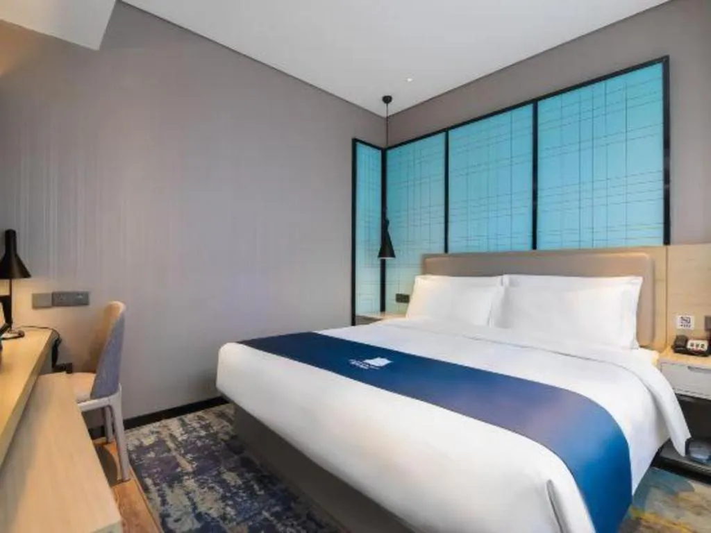 Bed in Echarm Hotel Changsha Wuyi Square Railway Metro Station