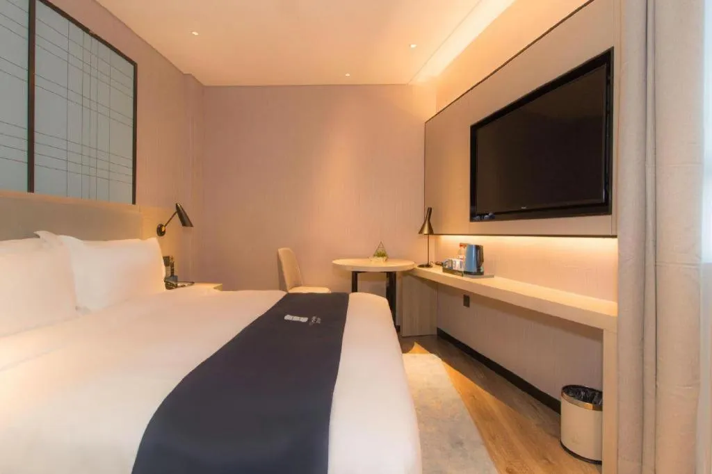 Bed in Echarm Hotel Changsha Wuyi Square Railway Metro Station