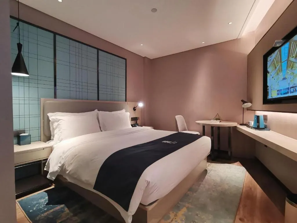 Bed in Echarm Hotel Changsha Wuyi Square Railway Metro Station
