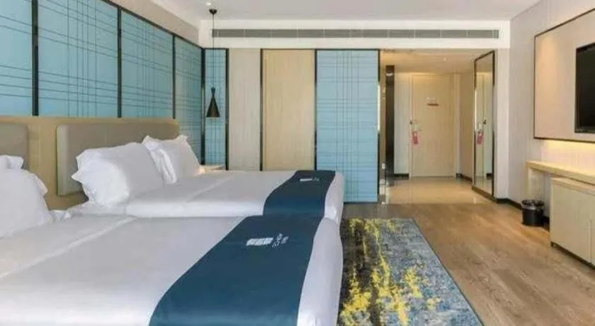 Bed in Echarm Hotel Changsha Wuyi Square Railway Metro Station
