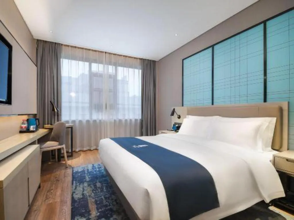 Bed in Echarm Hotel Changsha Wuyi Square Railway Metro Station