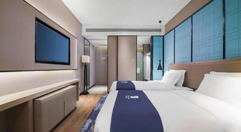 Bed in Echarm Hotel Changsha Wuyi Square Railway Metro Station