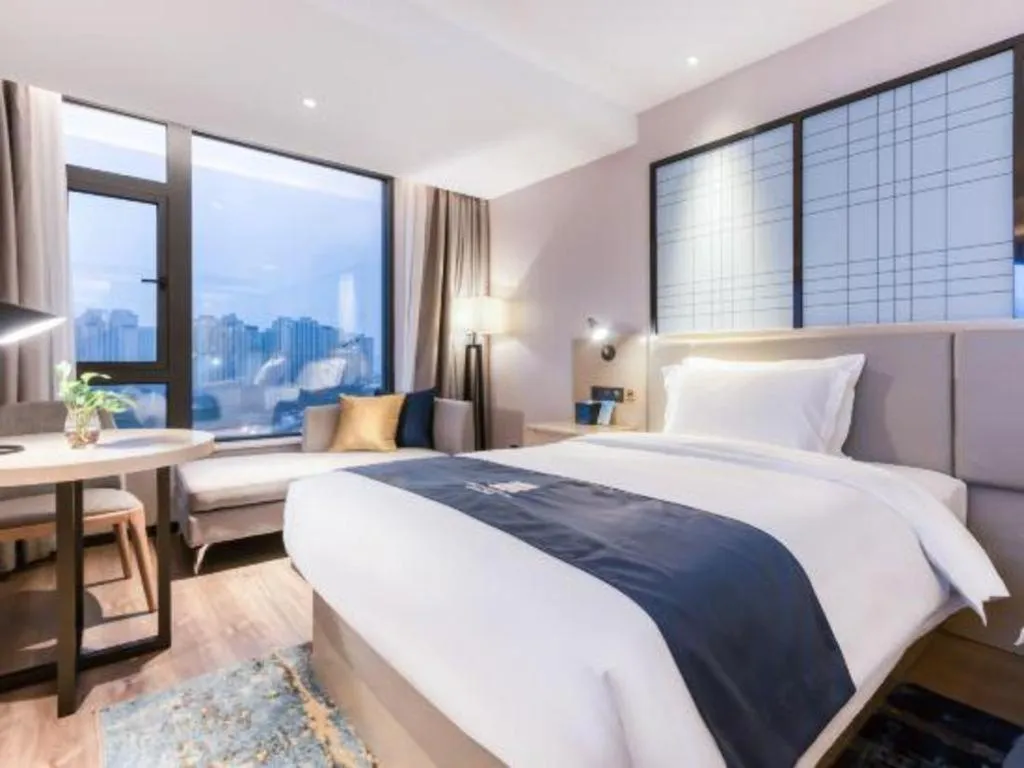Bed in Echarm Hotel Huzhou Wuyue Plaza Children's Clothing City
