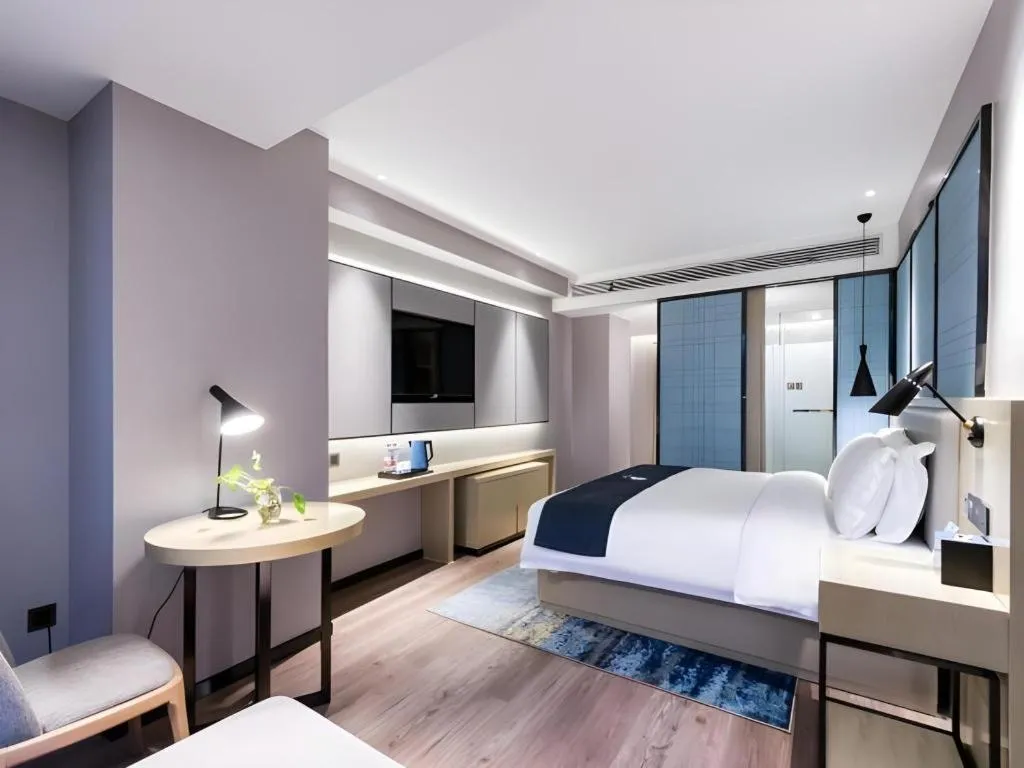 Bed in Echarm Hotel Huzhou Wuyue Plaza Children's Clothing City