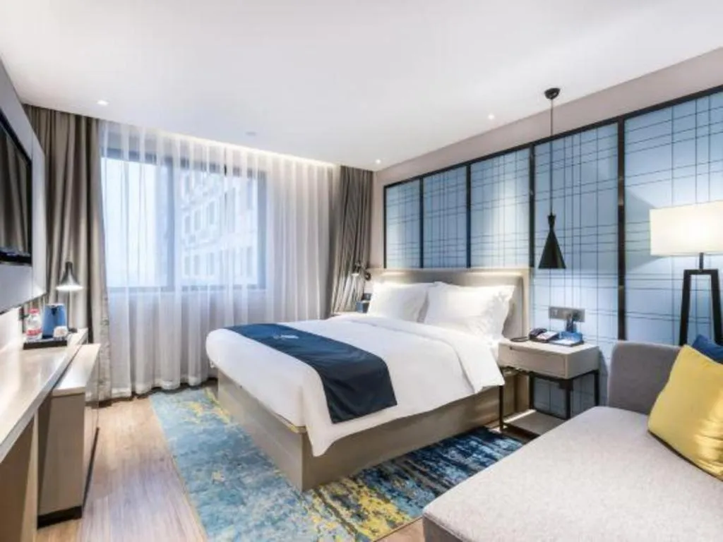 Bed in Echarm Hotel Huzhou Wuyue Plaza Children's Clothing City