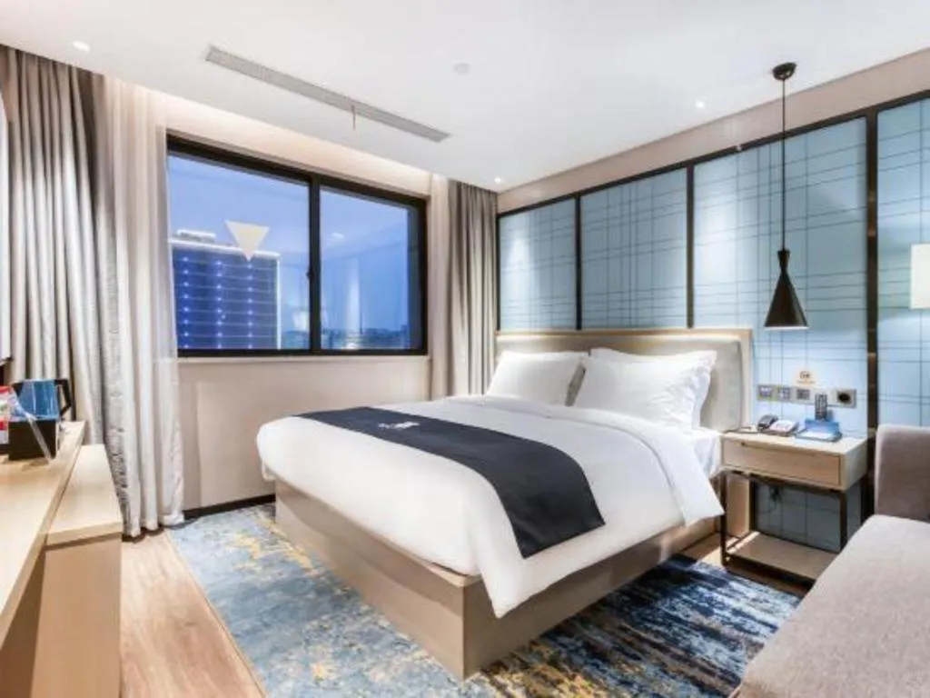 Bed in Echarm Hotel Huzhou Wuyue Plaza Children's Clothing City