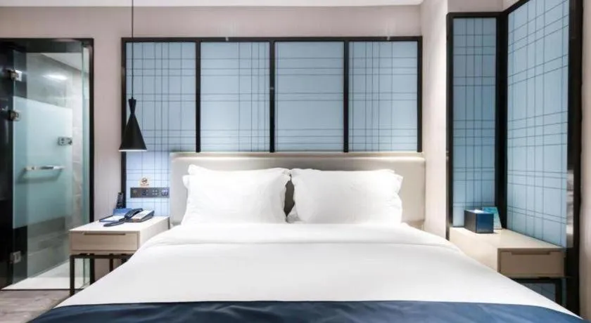 Bed in Echarm Hotel Huzhou Wuyue Plaza Children's Clothing City