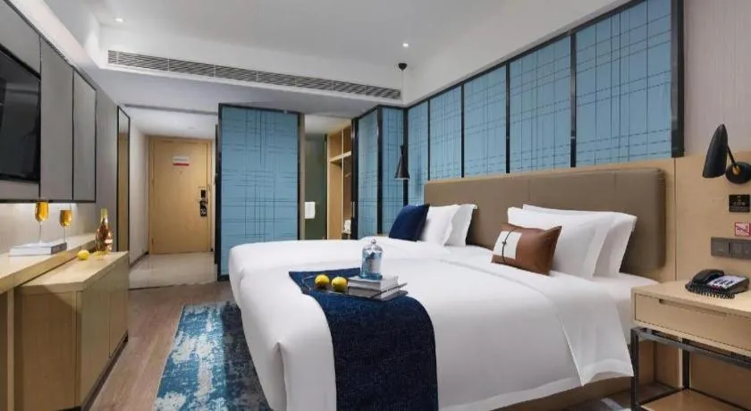 Bed in Echarm Hotel Nanjing Lishui High-speed Railway Station Wuzhou Commercial City