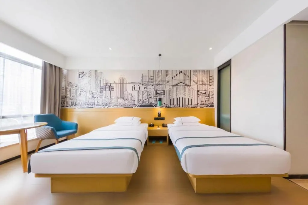 Bed in City Comfort Inn Kunming Flower City Midea Shuncheng Mansion