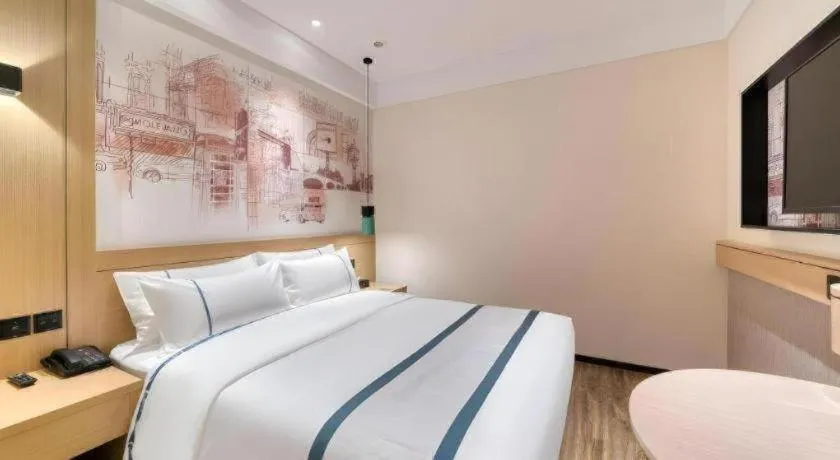 Bed in City Comfort Inn Kunming Flower City Midea Shuncheng Mansion