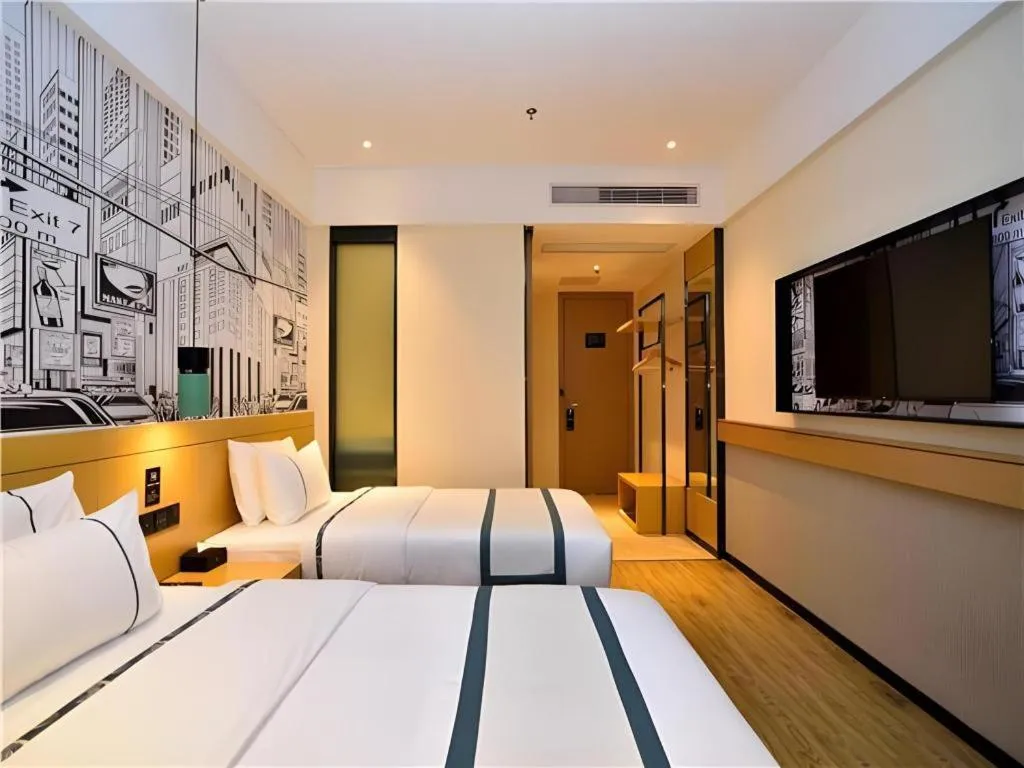 Bed in City Comfort Inn Kunming Flower City Midea Shuncheng Mansion