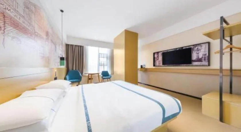 Bed in City Comfort Inn Kunming Flower City Midea Shuncheng Mansion