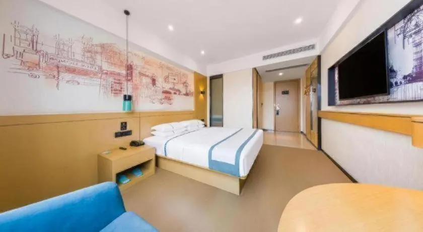 Bed in City Comfort Inn Kunming Flower City Midea Shuncheng Mansion