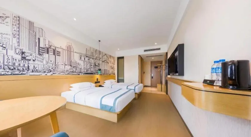 Bed in City Comfort Inn Kunming Flower City Midea Shuncheng Mansion