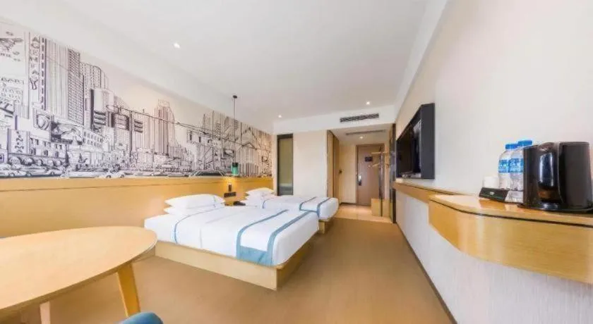 Bed in City Comfort Inn Kunming Flower City Midea Shuncheng Mansion