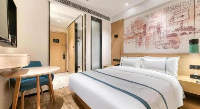 Bed in City Comfort Inn Kunming Flower City Midea Shuncheng Mansion