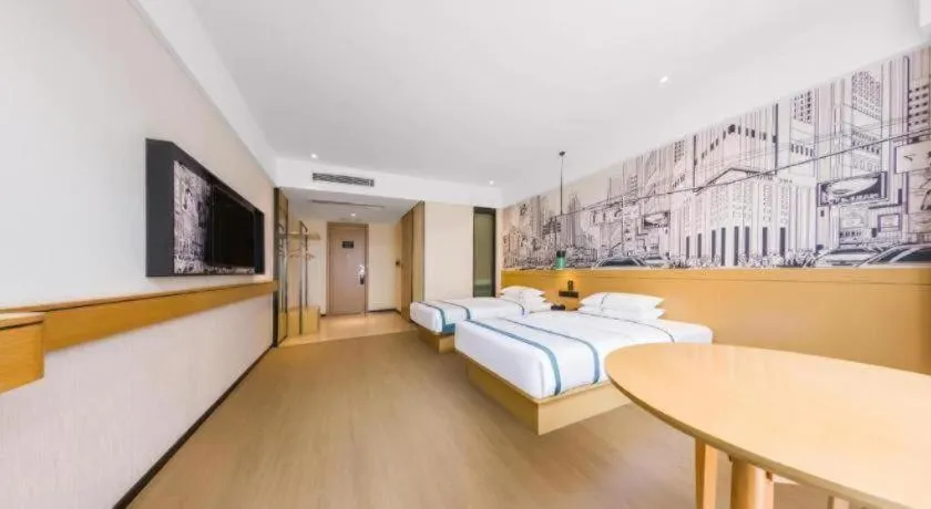 Bed in City Comfort Inn Kunming Flower City Midea Shuncheng Mansion