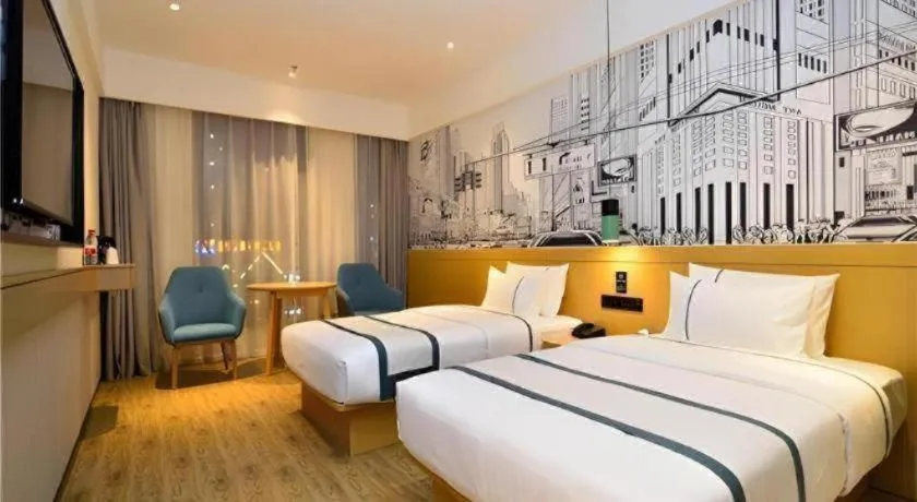 Bed in City Comfort Inn Kunming Flower City Midea Shuncheng Mansion