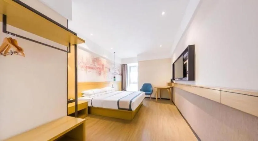 Bed in City Comfort Inn Kunming Flower City Midea Shuncheng Mansion