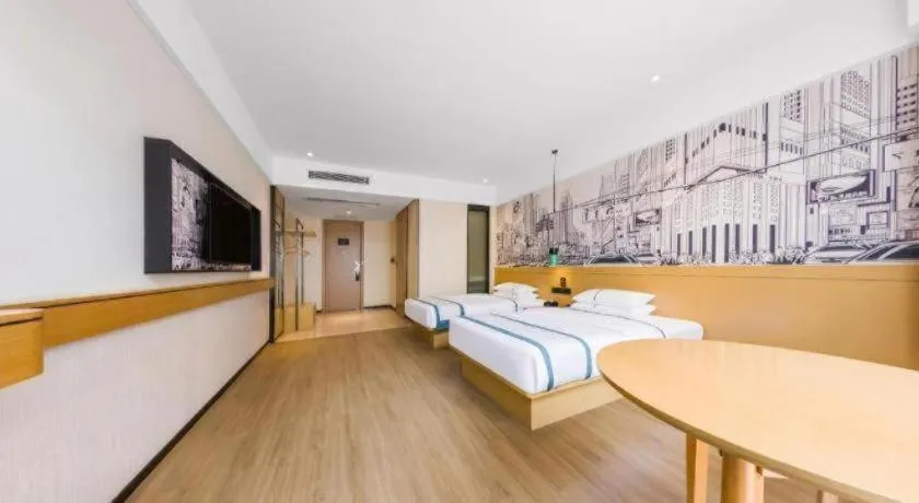 Bed in City Comfort Inn Kunming Flower City Midea Shuncheng Mansion