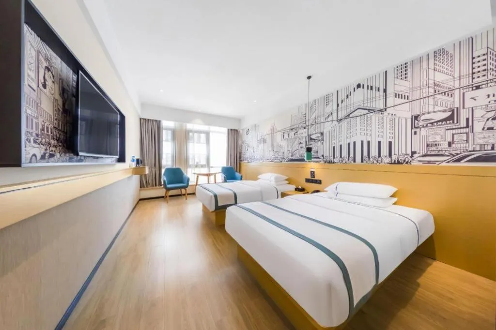 Bed in City Comfort Inn Kunming Flower City Midea Shuncheng Mansion