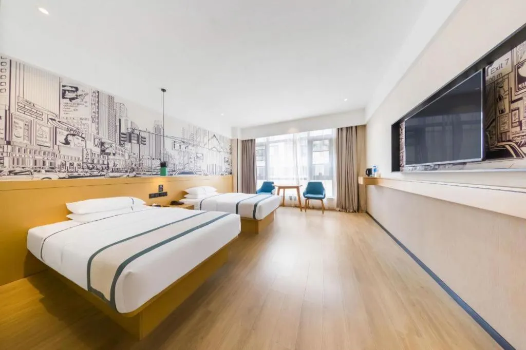 Bed in City Comfort Inn Kunming Flower City Midea Shuncheng Mansion