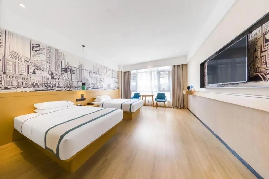 Bed in City Comfort Inn Kunming Flower City Midea Shuncheng Mansion