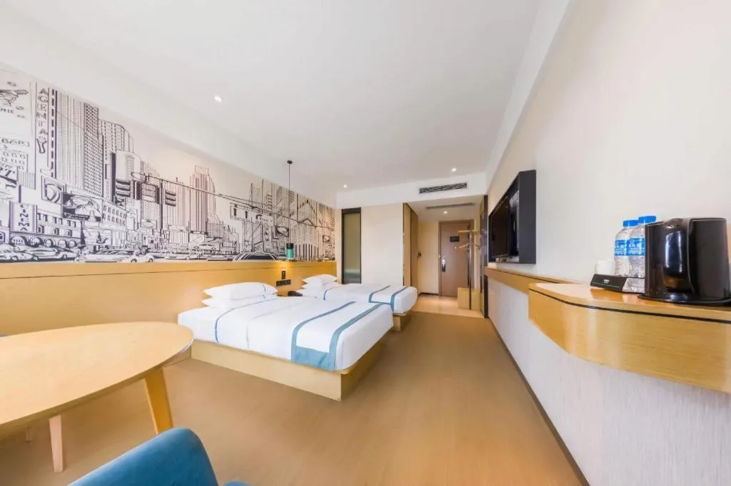 Bed in City Comfort Inn Kunming Flower City Midea Shuncheng Mansion