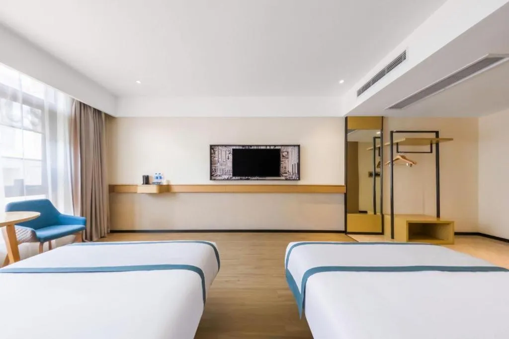 Bed in City Comfort Inn Kunming Flower City Midea Shuncheng Mansion