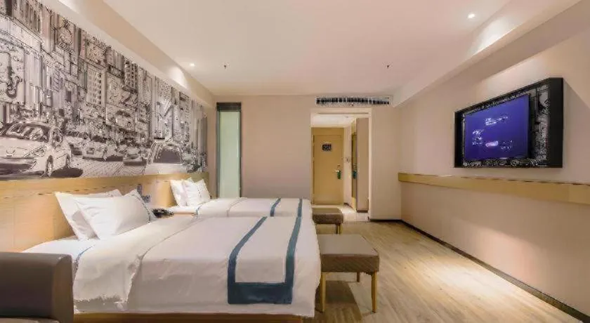 Bed in City Comfort Inn Shiyan High-speed Railway Wanda Plaza