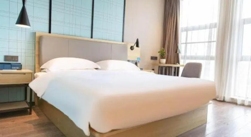 Bed in Echarm Hotel Hefei West Qilitang Metro Station