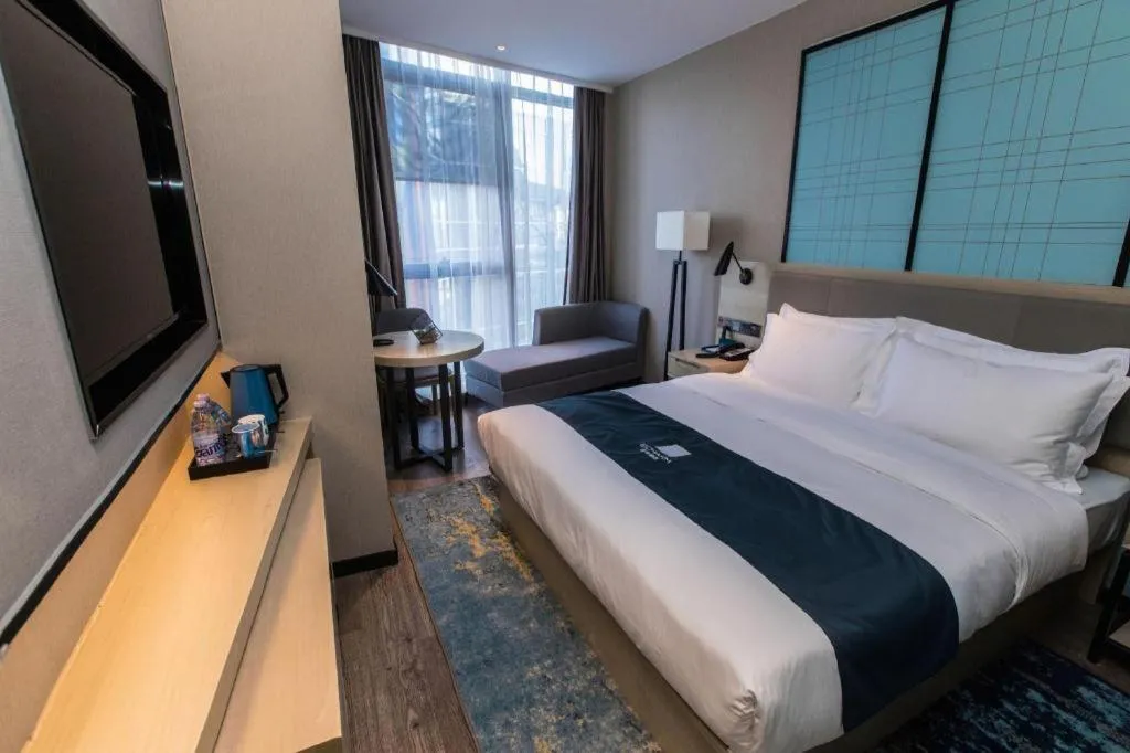 Bed in Echarm Hotel Hefei West Qilitang Metro Station