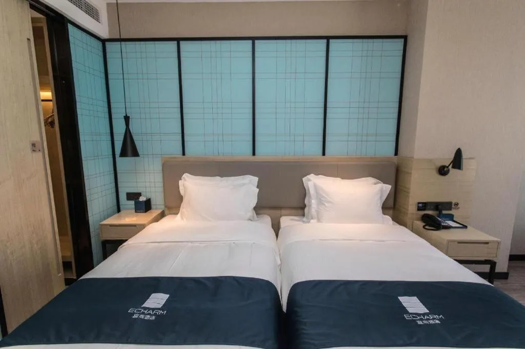 Bed in Echarm Hotel Hefei West Qilitang Metro Station