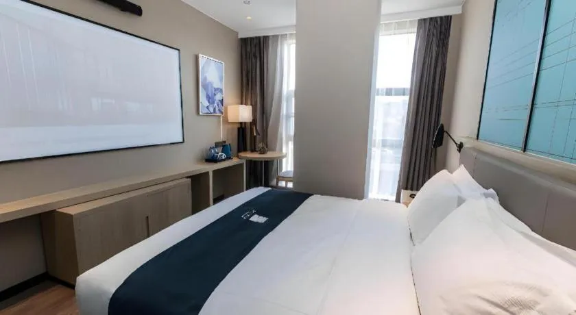 Bed in Echarm Hotel Hefei West Qilitang Metro Station