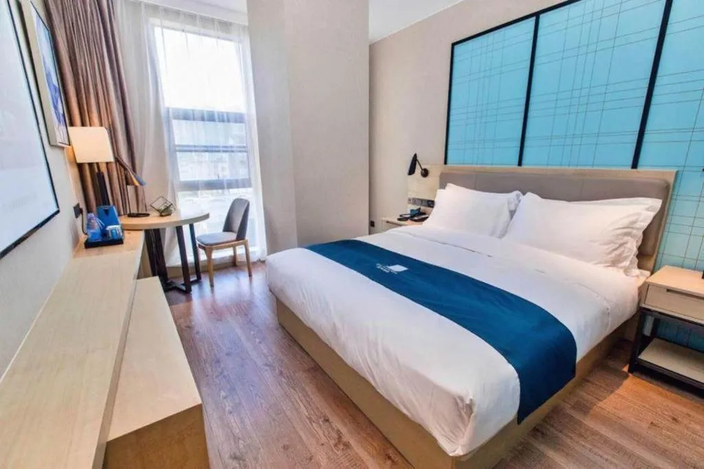 Bed in Echarm Hotel Hefei West Qilitang Metro Station