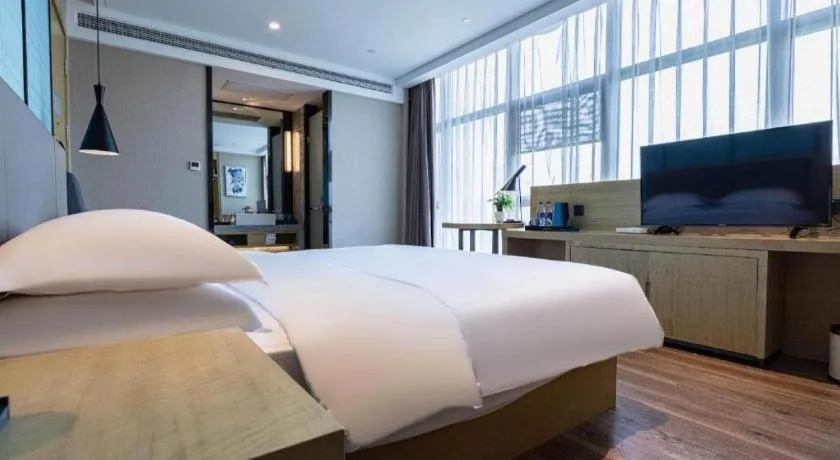 Bed in Echarm Hotel Hefei West Qilitang Metro Station