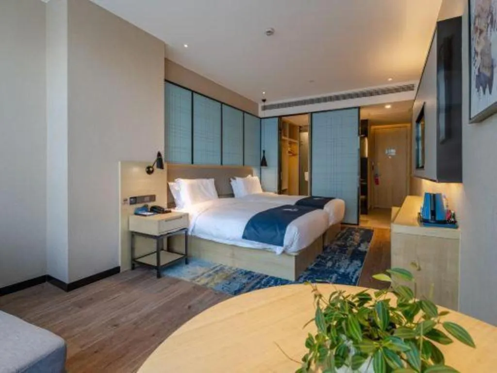 Bed in Echarm Hotel Hefei West Qilitang Metro Station